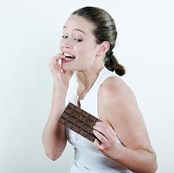 woman with a large bar of chocolate