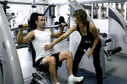 man exercising with woman trainer