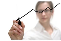 woman marking progress on a graph